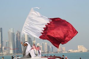 flags and confetti qatar national day by ramyk d4jgxew