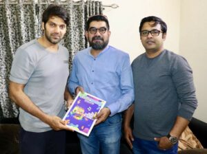Handing over our Newsletter to Actor Arya