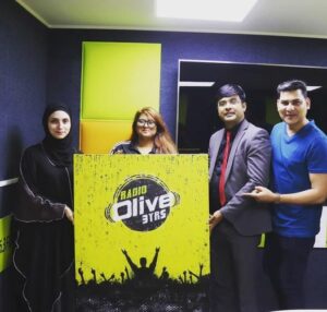 Receiving the Radio Olive Logo Painting From Ms Samah Al-lulu, A renowned Artist, Painter and designer!